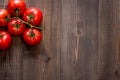 Prepring for cooking dinner. Tomato on wooden table background top view copyspace