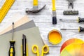 Preraring for home repair. Tools on grey wooden desk background top view copyspace