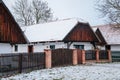 Prerov nad Labem, Czech Republic, 5 December 2021: Traditional village wooden farm house in winter, historic country-style