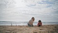 Preschool boy playing beach with young mother. Happy parent kid resting together Royalty Free Stock Photo