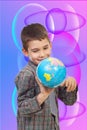 Preschool boy playing with a globe Royalty Free Stock Photo