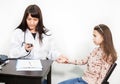 Preschool girl medical visit, doctor measuring blood pressure of a child