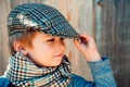Preschool child. Boy face. Elegant child. Autumn weather. People, adorable kid, funny portrait. Cap hat and scarf.