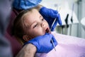 Preschool child at dentist exam. Close up.