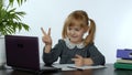 Preschool child girl distance online learning at home. Kid studying using digital laptop computer Royalty Free Stock Photo