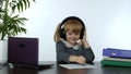 Preschool child girl distance online learning at home. Kid studying using digital laptop computer Royalty Free Stock Photo