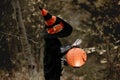 Preschool child with halloween costume and jack` o` lantern in a forest, scary skelleton