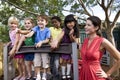 Preschool children on playground with teacher Royalty Free Stock Photo