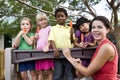Preschool children on playground with teacher Royalty Free Stock Photo