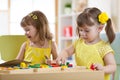 Preschool children playing with educational sorter toys in classroom, kindergarten or home Royalty Free Stock Photo