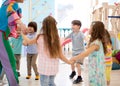 Children playing games holding hands in circle in daycare Royalty Free Stock Photo