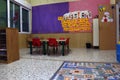 Preschool classroom with red chairs and table Royalty Free Stock Photo