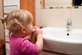 Preschool girl brushing teeth