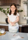 The child prepares the dough. Homemade plastiline.