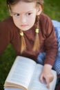 Preschool girl reading books. Little genius concept. Royalty Free Stock Photo