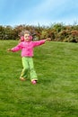 Preschool girl running down the hill Royalty Free Stock Photo