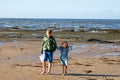 Preschool Girl and School Boy, Siblings on a Norman Beach in Normandy, Embracing the Joy of Sandy Shores, Seashells, and Royalty Free Stock Photo