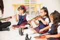 Preschool students learning some music Royalty Free Stock Photo