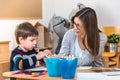 Preschool teacher with child at Kindergarten - Creative Art Class Royalty Free Stock Photo