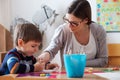 Preschool teacher with child at Kindergarten - Creative Art Class Royalty Free Stock Photo