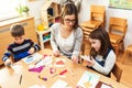 Preschool Teacher with Children at Kindergarten - Creative Art Class Royalty Free Stock Photo