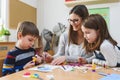 Preschool Teacher with Children at Kindergarten - Creative Art Class Royalty Free Stock Photo