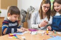 Preschool Teacher with Children at Kindergarten - Creative Art Class Royalty Free Stock Photo