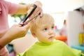 Preschooler boy getting haircut Royalty Free Stock Photo