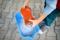 Preschooler boy helping his father washing family car. Little dad helper. Family with children spends time together Royalty Free Stock Photo