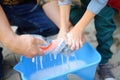 Preschooler boy helping his father washing family car. Little dad helper. Family with children spends time together Royalty Free Stock Photo