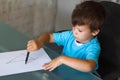 Preschooler boy learn writing letters Royalty Free Stock Photo