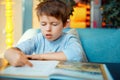 Preschooler boy reading book Royalty Free Stock Photo