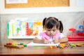 Preschooler child girl drawing and coloring Royalty Free Stock Photo