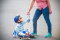 Preschooler falls over while rollerblading with mother in the pa