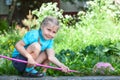 Preschooler girl portrait when cathing butterfly