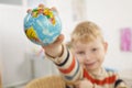 Preschooler with globe in a hand Royalty Free Stock Photo