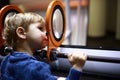 Preschooler looking through magnifying glass system
