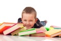 Preschooler with pile of books