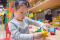 Preschooler playing blocks at school