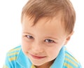 Preschooler pose. Closeup studio portrait of a cute young boy  on white. Royalty Free Stock Photo