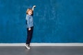 Preschooler showing height on backdrop with