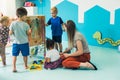 preschoolers painting on the special box in the kindergarten Royalty Free Stock Photo