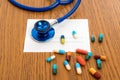 Prescription with colorful pills and stethoscope Royalty Free Stock Photo