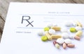 Prescription form and medicines on the desk .