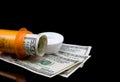 Prescription pill bottle with money Royalty Free Stock Photo