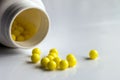 Prescription pill bottle spilling pills on to surface o Royalty Free Stock Photo