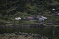 Old farmhouses adorn the valley and mountain walls of Faja Dos Cubres on the island of Sao Jorge, part of the Azores archipelago.