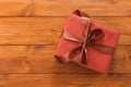 Present in gift box on wood background with copy space Royalty Free Stock Photo