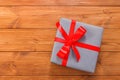 Present in gift box on wood background with copy space Royalty Free Stock Photo