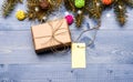 Present box and gift tag copy space. Winter time and christmas holidays concept. Tips for preparing christmas in advance Royalty Free Stock Photo